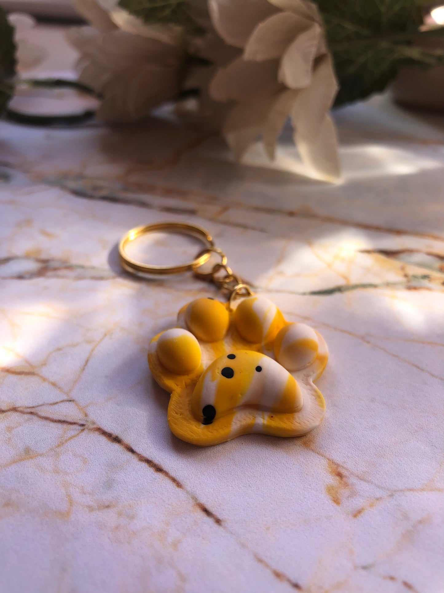 Huellas solidarias (llaveros)